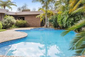 Poolside Palms Oasis