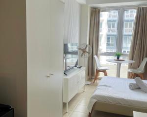 City View Condo in Pasig with Pool, WiFi and Netflix