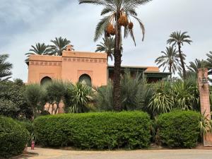 Palmeraie village , lieu exceptionnel avec jardin et piscine