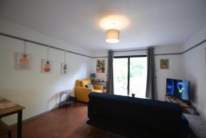 Stylish 1BR Retreat with Garden and Rustic Kitchen