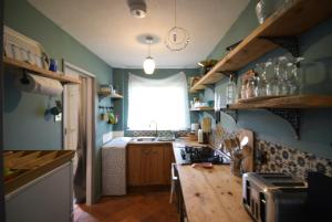 Stylish 1BR Retreat with Garden and Rustic Kitchen