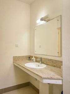 Coastal Charm Apartment l 2 Bedrooms situated on second floor l Mont Choisy l Shared Pool l Fully Equipped Kitchen l Parking Space l Close toamenities