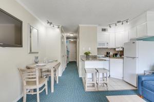 Steps to Galveston Beach Corner-Unit Condo!