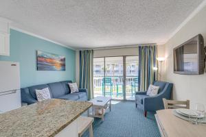 Steps to Galveston Beach Corner-Unit Condo!