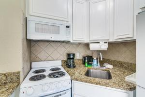 Steps to Galveston Beach Corner-Unit Condo!