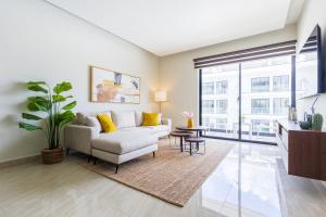 2BR Tropical Escape - Private Terrace, BBQ, Pool, Walk to Beach