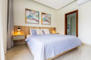 2BR Tropical Escape - Private Terrace, BBQ, Pool, Walk to Beach