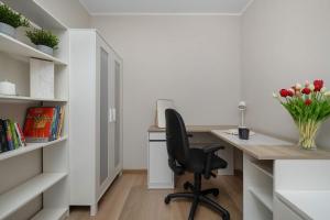 Red Apartment in Wrocław with Two Bedrooms and Desk for Remote Work by Noclegi Renters