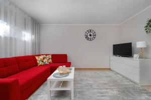 Red Apartment in Wrocław with Two Bedrooms and Desk for Remote Work by Noclegi Renters