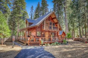 Classic Cabin in the Pines by Tahoe Getaways - Walk to Lake, Pet-Friendly 3 BR w Yard & Hot Tub!