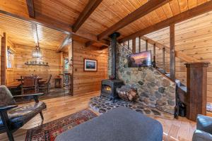 Classic Cabin in the Pines by Tahoe Getaways - Walk to Lake, Pet-Friendly 3 BR w Yard & Hot Tub!