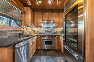 Classic Cabin in the Pines by Tahoe Getaways - Walk to Lake, Pet-Friendly 3 BR w Yard & Hot Tub!