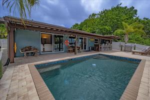 Waterfront Retreat with Pool Tiki Bar & Boat Dock