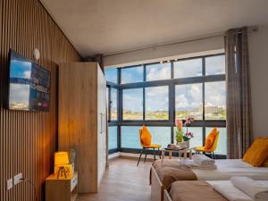 Sunny Beach House with Jacuzzi - Steps from the Sea