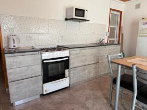 Casa 2 hab patio grande