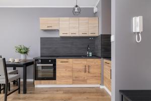 Stylish Apartment Pachońskiego with Parking in Kraków by Noclegi Renters