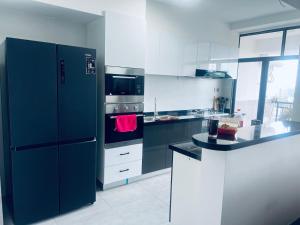 modern serenity suites three bedroom apartmen with Dsq , restaurant ,equipped gym,private parking space, children playing ground, proximity to major shopping malls and unbeatable city views