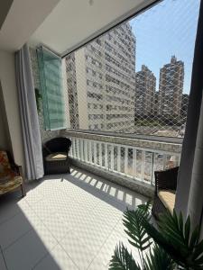 Apto Guarujá beira-mar com Wi-Fi e ar-condicionado