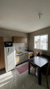 Linda casa bem localizada em Passo de Torres