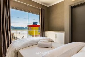 Duplex pé na areia com vista deslumbrante RAT001