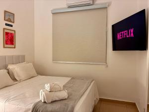 Moderno e Aconchegante a 3 min a pé da Praia, Espaço para Relaxar, Lava e Seca