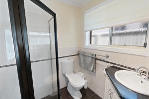 Comfortable 4-Bedroom Home with Backyard Escape