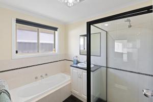 Comfortable 4-Bedroom Home with Backyard Escape