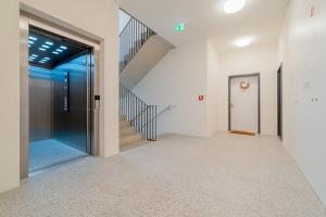 The Elegant White Suite in SmichovCity Residence by Rentez