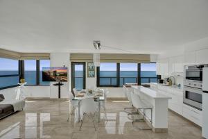 Stylish Oceanfront 2BR 1 and a half BA Condo with Resort Amenities Pools Gym Sauna 1402