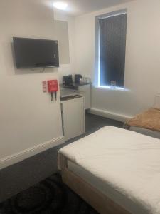 studio apartment with small kitchen and bathroom