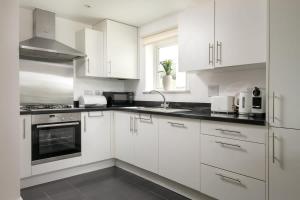 Modern Cotswolds lakeside retreat spa and pool