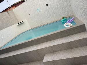 Casa com piscina lado praia