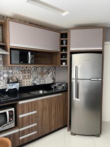 Apt 1 quarto , com vista incrível , pé na areia da cachoeira