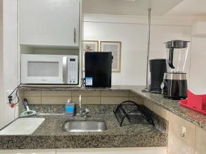 Apartamento em condomínio com acesso à praia