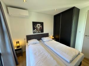 Enkhuizer Strand Chalet IJsselmeerblick Zweite Reihe mit Zaun Haus Nr 221