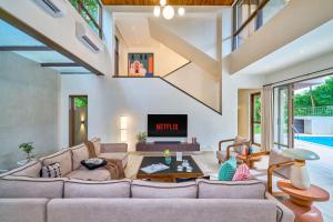 SaffronStays Sea Breeze - 4BR pool villa with games room, terrace & lawns near Saral Beach & Mandwa Jetty, Alibaug