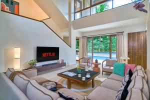 SaffronStays Sea Breeze - 4BR pool villa with games room, terrace & lawns near Saral Beach & Mandwa Jetty, Alibaug