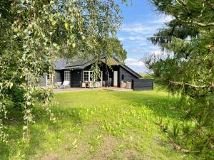 Lovely Black Wooden House Near Tisvilde Hegn
