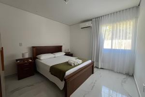 Casa com Piscina a 5 min da Praia – 3 Quartos, AC