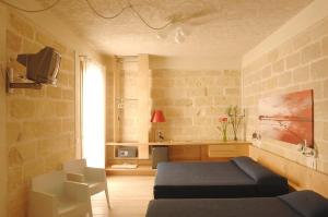 Classic Triple Room room in Cave Bianche Hotel