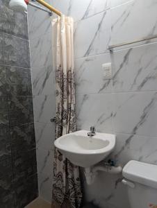 Suite Práctica de Dos Ambientes Cocina y Sofá Cama