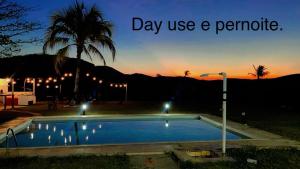 Espaço fazendinha por do Sol da piscina