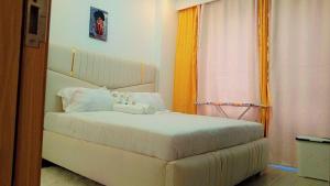 modern serenity suites apartments with swimming pool,modern equipped gym,private parking space, children playing ground, proximity to major shopping malls and unbeatable city views