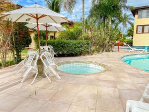 Casas com 2 ou 3 suítes no Residencial Jerusalem 2,frente mar em Coroa Vermelha (BA), condomíonio com piscina, sauna e portaria 24hrs atravessou a rua está no mar.