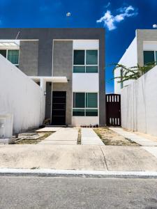 Cómodo alojamiento familiar al sur de Cancún con 2 habitaciones y cocina