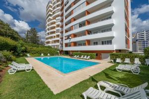 Sunlit Poolside Retreat w Balcony by HostWise