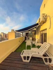 Penthouse con parrillero, terraza y estufa a leña