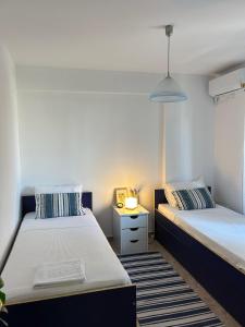 Sunny Modern Beach Retreat Steps from the Shore