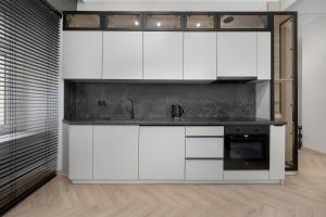 Beige Apartment in Wrocław Center with Home Office by Noclegi Renters