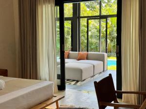 3BR Tropical Villa with Pool & Lush Garden Oasis, 4 minutes to the beach